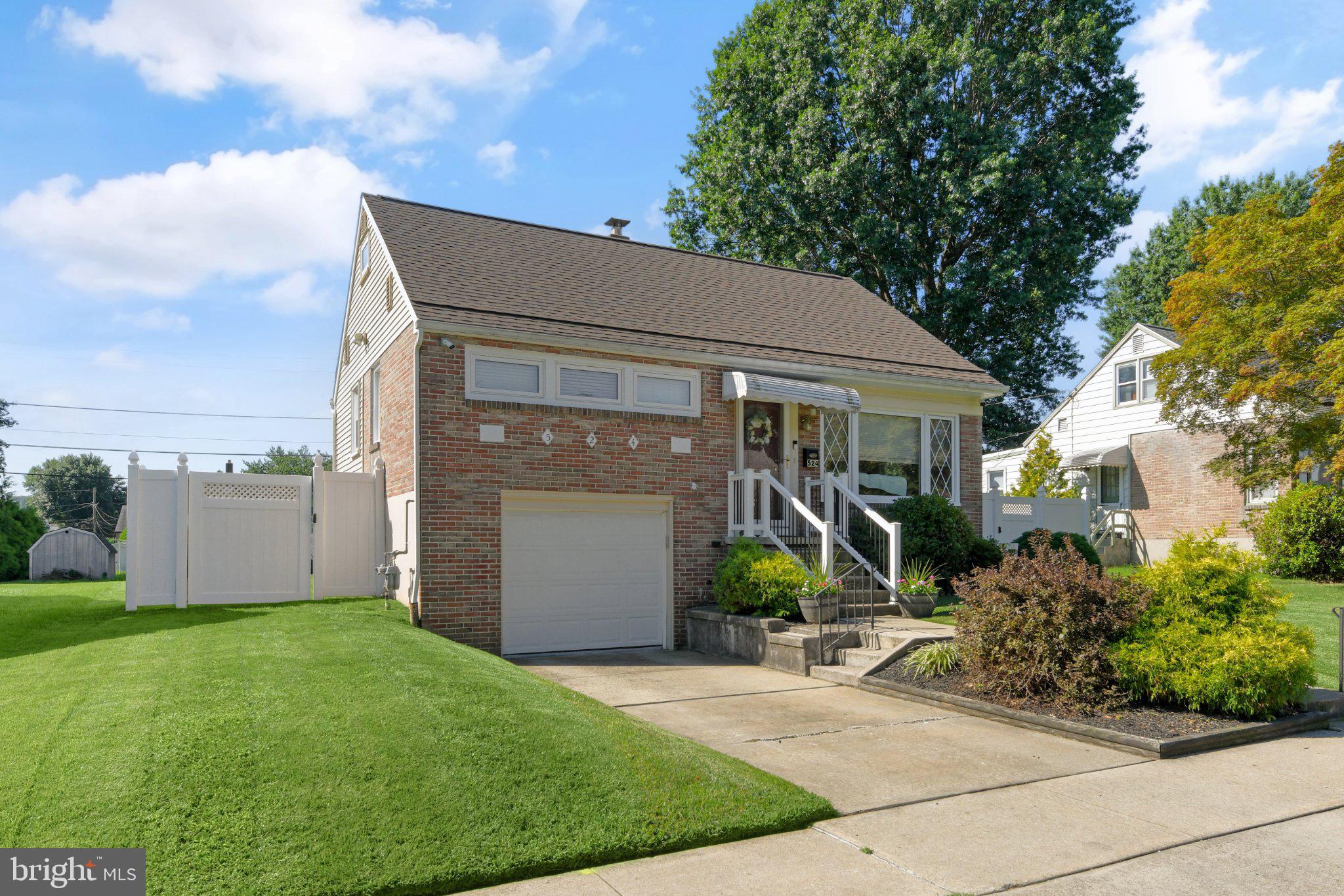 524 Harding Avenue Shillington, PA 19607 - Photo 34 of 37 Charming brick home with lush greenery.