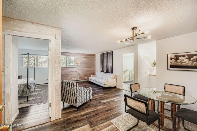 a view of a livingroom with furniture and hardwood floor