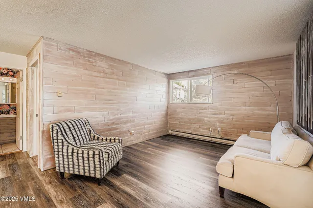 a view of room with wooden floor