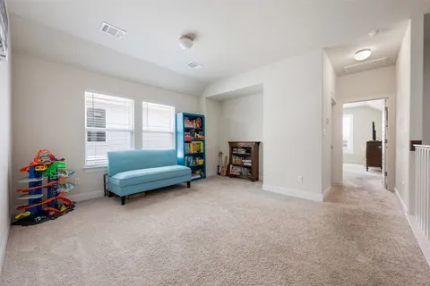 an empty room with toys and a window