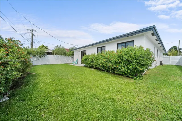 a front view of house with garden
