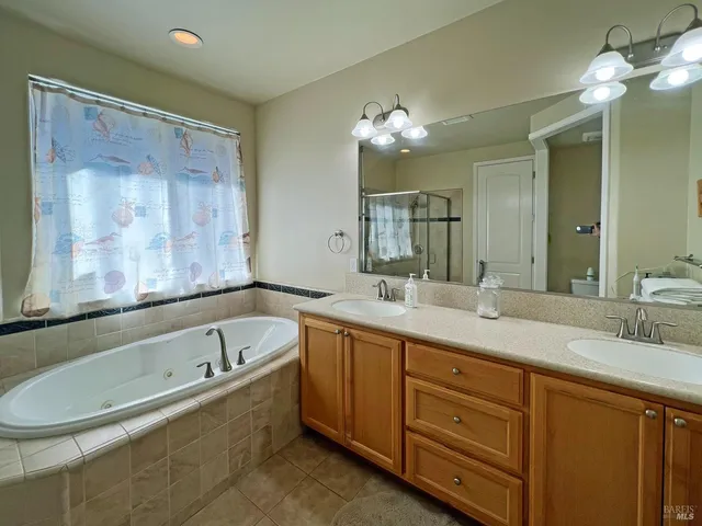 a bathroom with a tub and shower