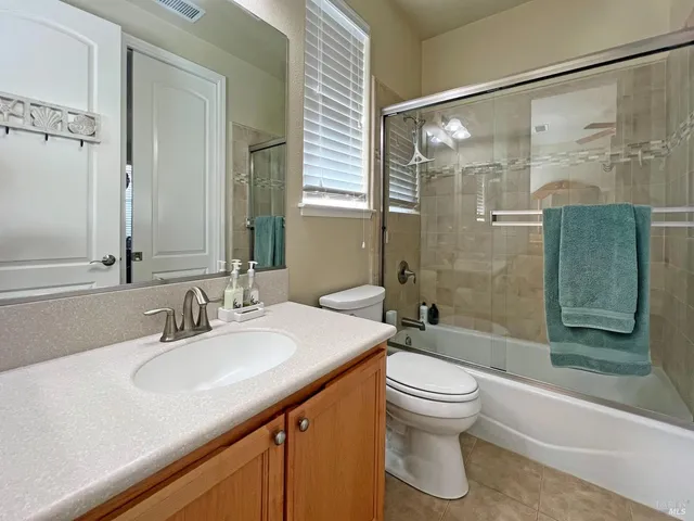 a view of house with backyard space and garden