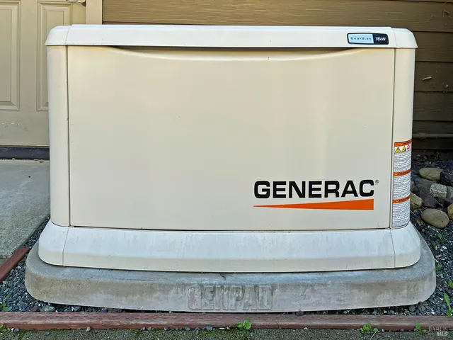 a sign of golf club on a wall under a tree