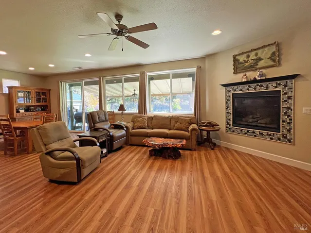 a living room with furniture fireplace and a flat screen tv