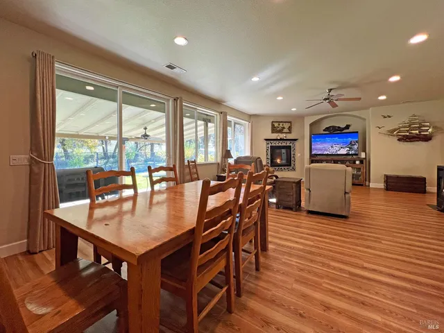 a view of a dining room with furniture window and wooden floor