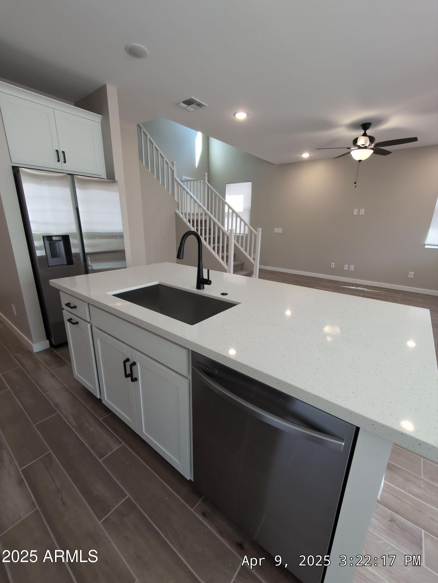 4514 South Pasteur Mesa, AZ 85212 - Photo 11 of 43 a kitchen with a sink and a refrigerator