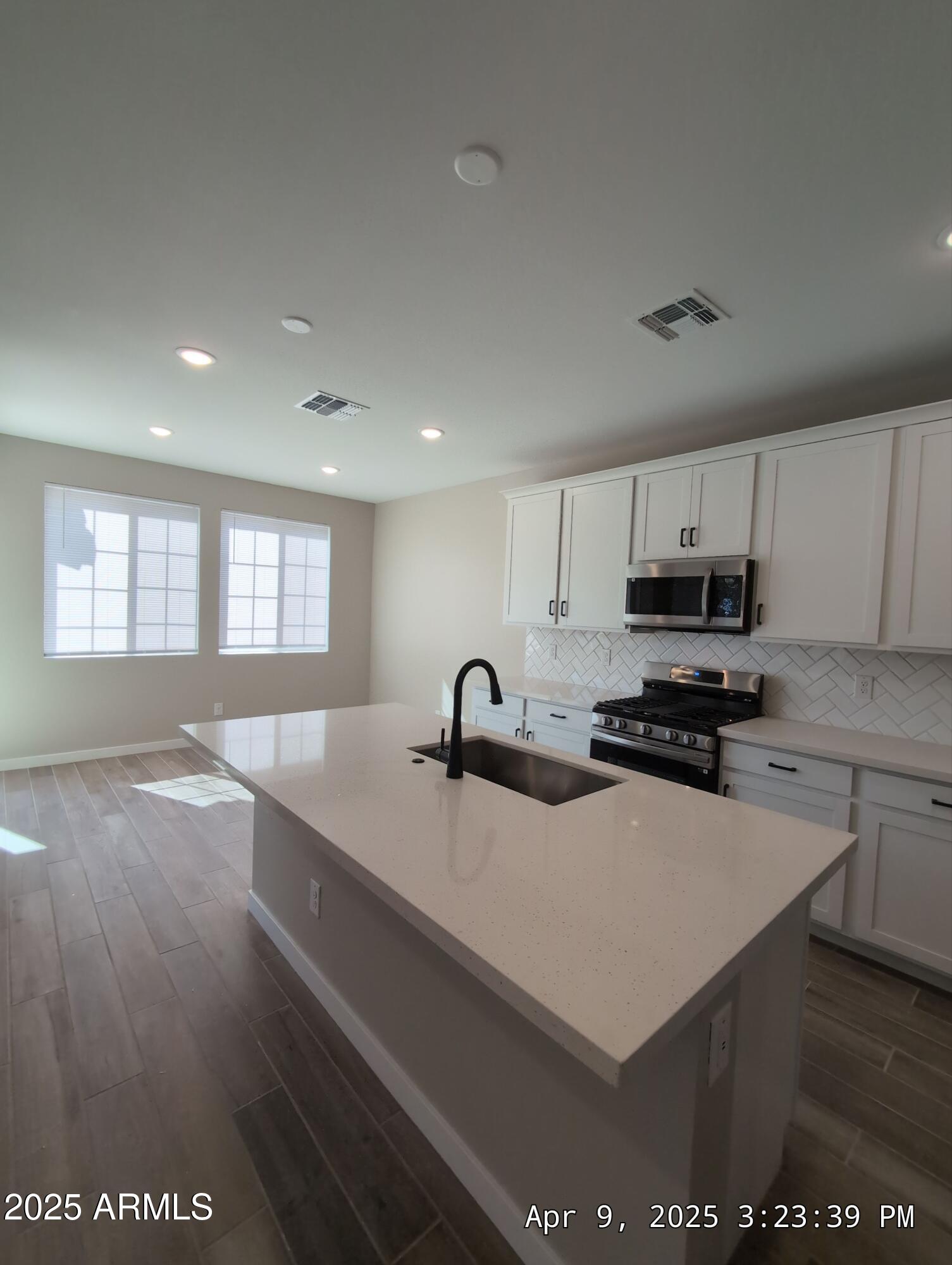 4514 South Pasteur Mesa, AZ 85212 - Photo 14 of 43 a kitchen with a sink a stove and cabinets
