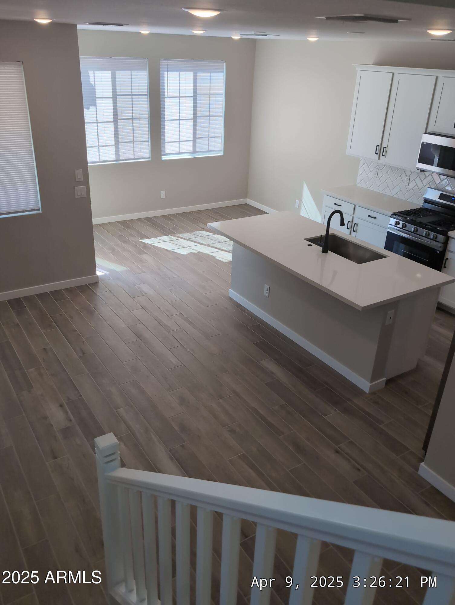 4514 South Pasteur Mesa, AZ 85212 - Photo 20 of 43 a view of an empty room with window and wooden floor