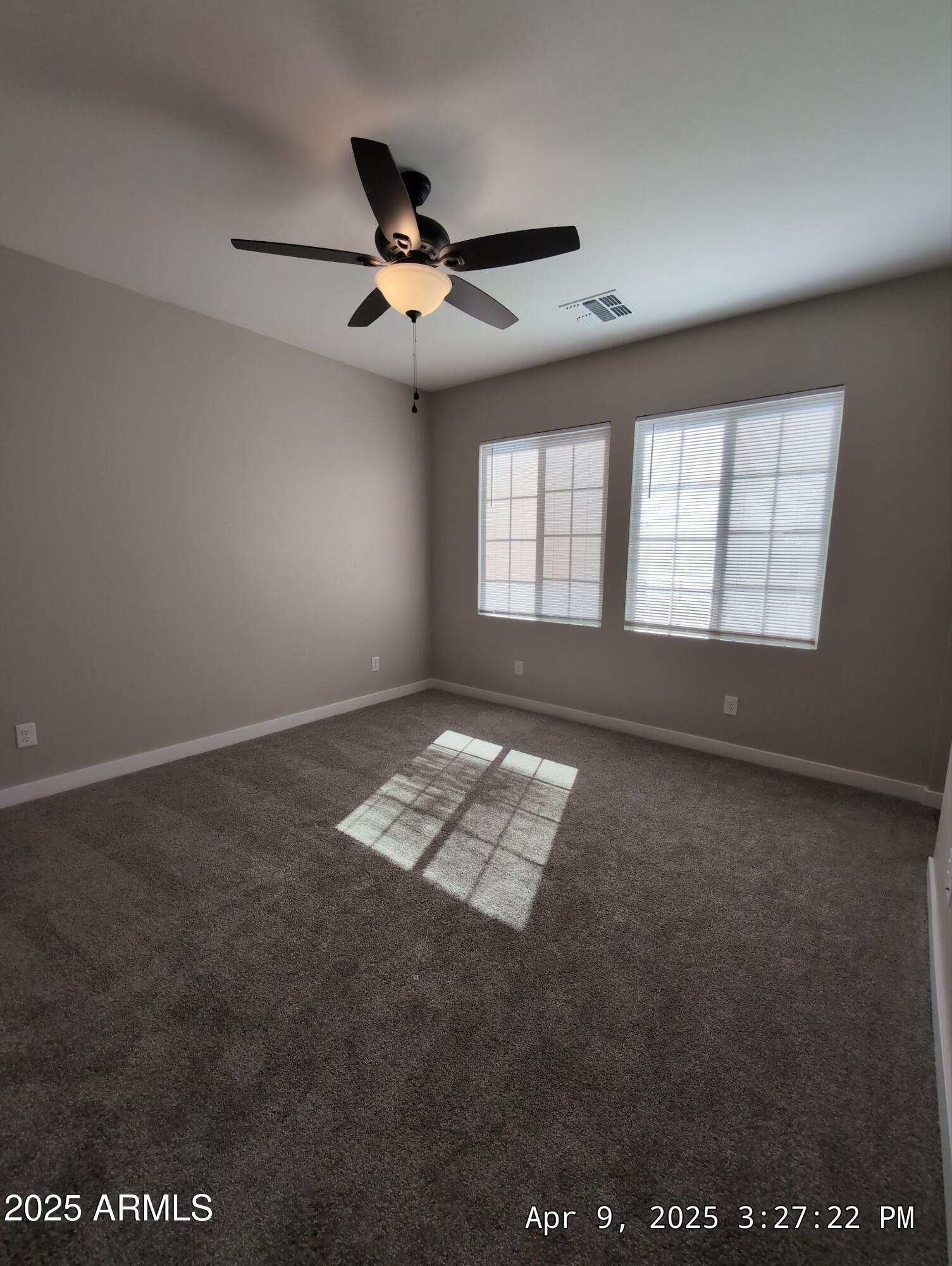 4514 South Pasteur Mesa, AZ 85212 - Photo 26 of 43 an empty room with windows and ceiling fan