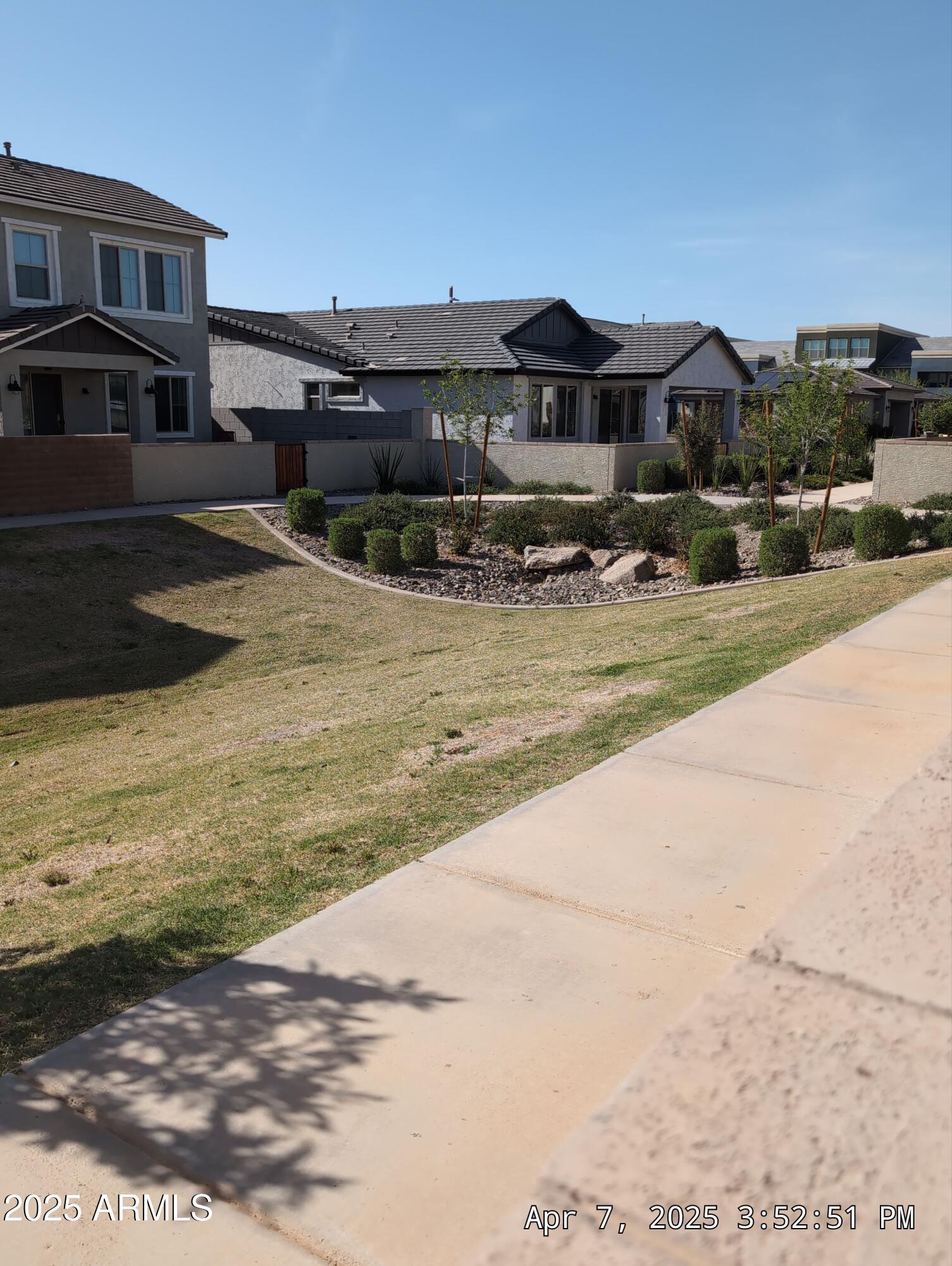 4514 South Pasteur Mesa, AZ 85212 - Photo 7 of 43 a front view of a house with a yard