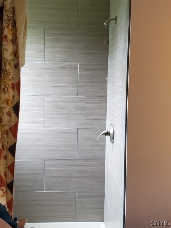 201 Tolbert Drive Clay, NY 13212 - Photo 11 of 22 Beautiful tiled shower in the main bedroom that is