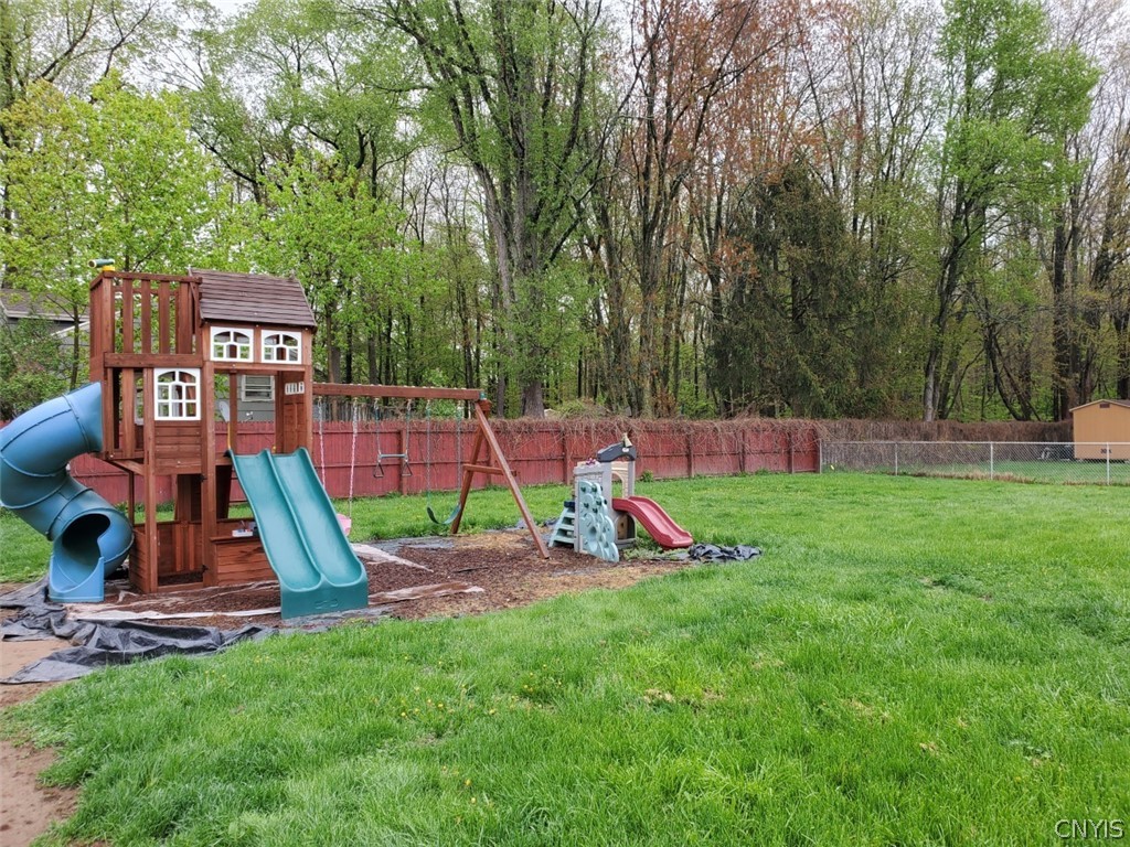 201 Tolbert Drive Clay, NY 13212 - Photo 19 of 22 Fully fenced backyard with playset included.