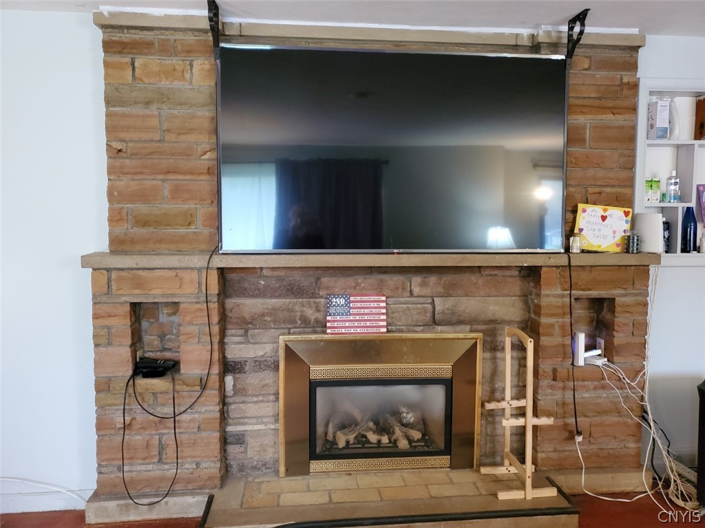 201 Tolbert Drive Clay, NY 13212 - Photo 6 of 22 Beautiful brick fireplace with gas insert.