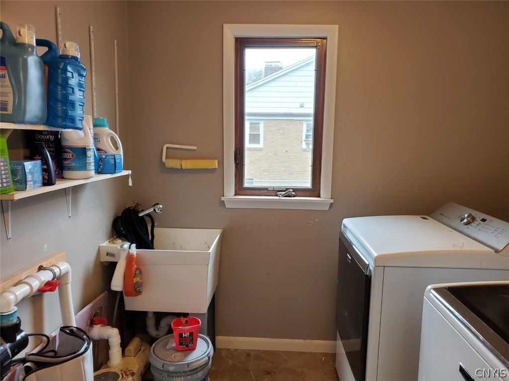 201 Tolbert Drive Clay, NY 13212 - Photo 8 of 22 Laundry room is spacious and right off the kitchen