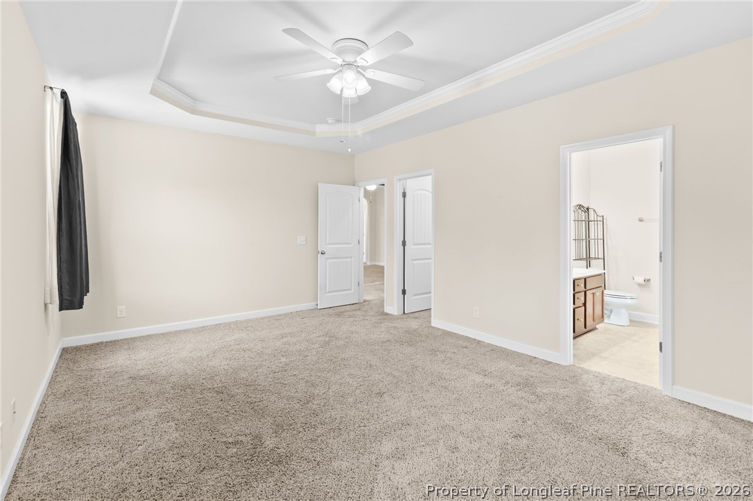 216 Meherrin Loop Raeford, NC 28376 - Photo 16 of 38 an empty room with closet and a ceiling fan