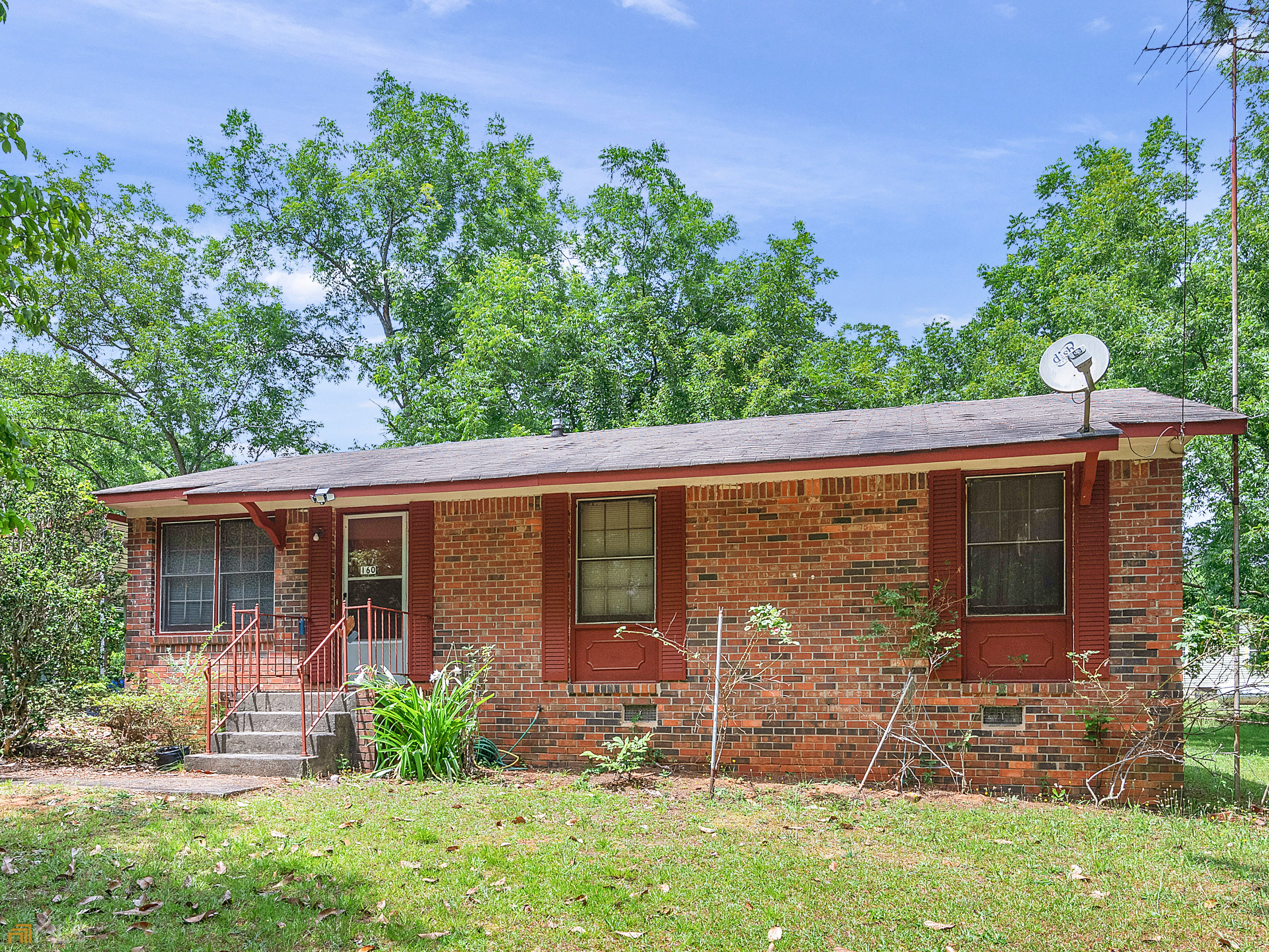 160 Skyler Road Milner, GA 30257 - Photo 1 of 1 front view of a house with garden