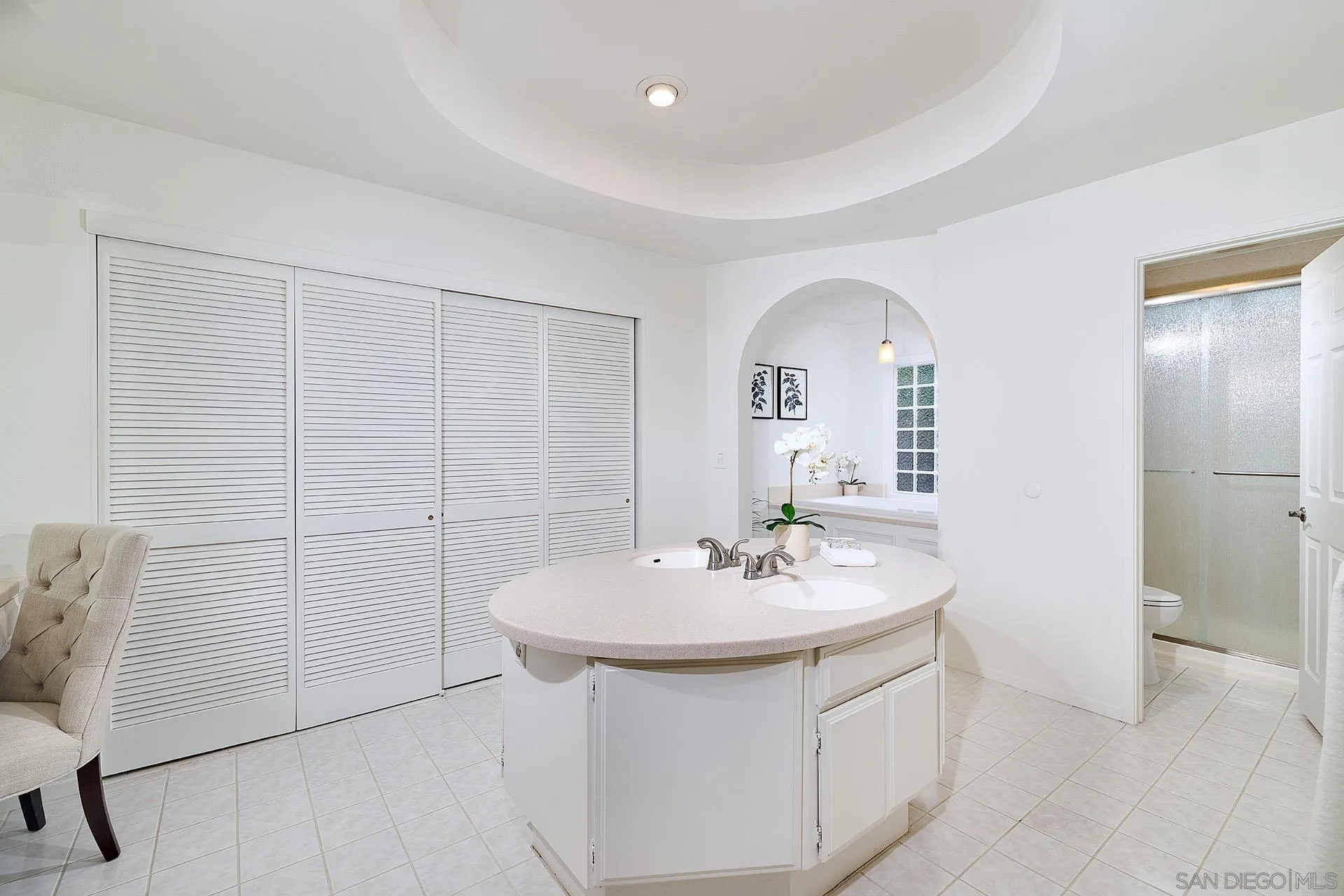 7627 Reposado Drive Carlsbad, CA 92009 - Photo 12 of 54 a bathroom with a sink and a mirror