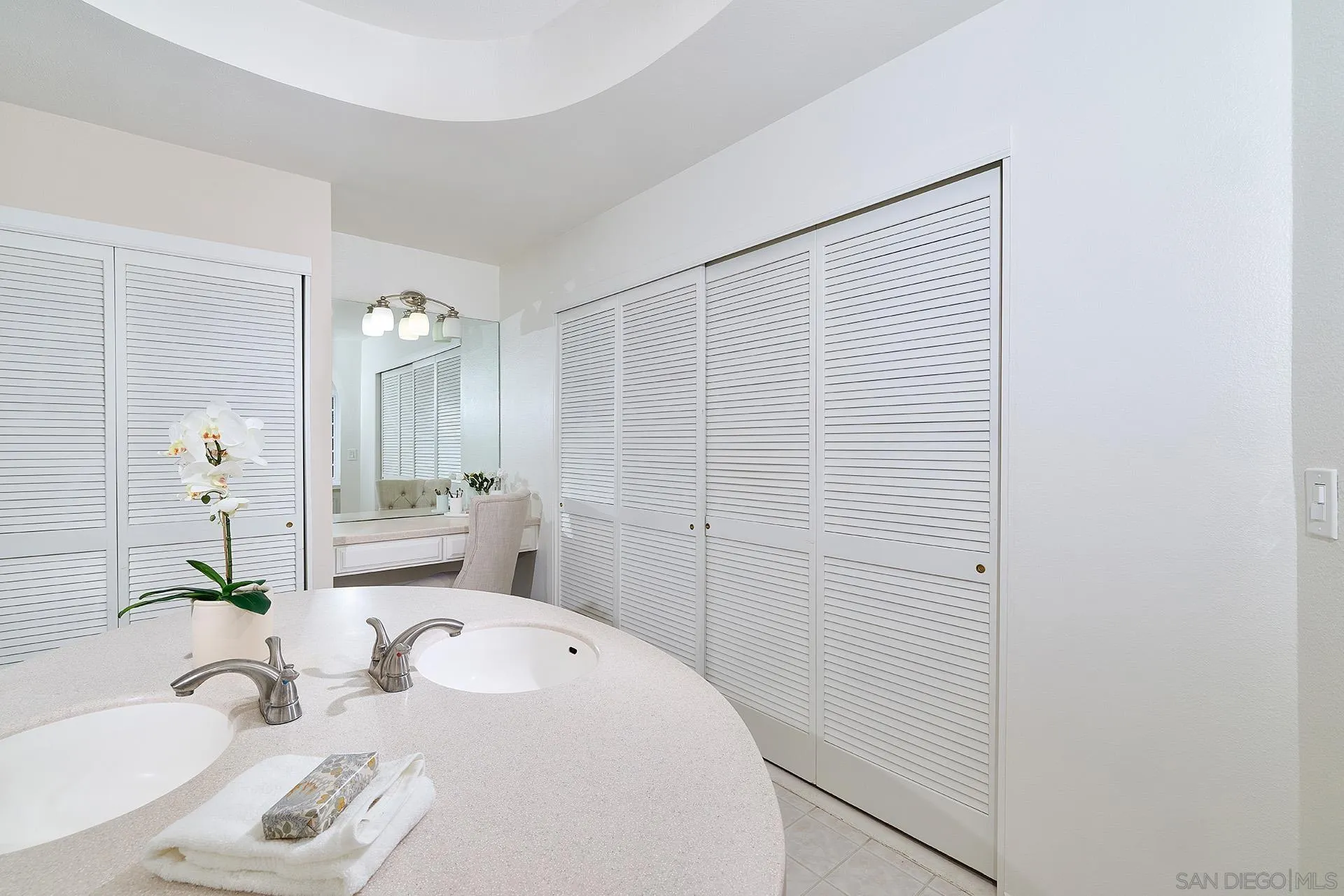 7627 Reposado Drive Carlsbad, CA 92009 - Photo 13 of 54 a bathroom with a sink and a tub