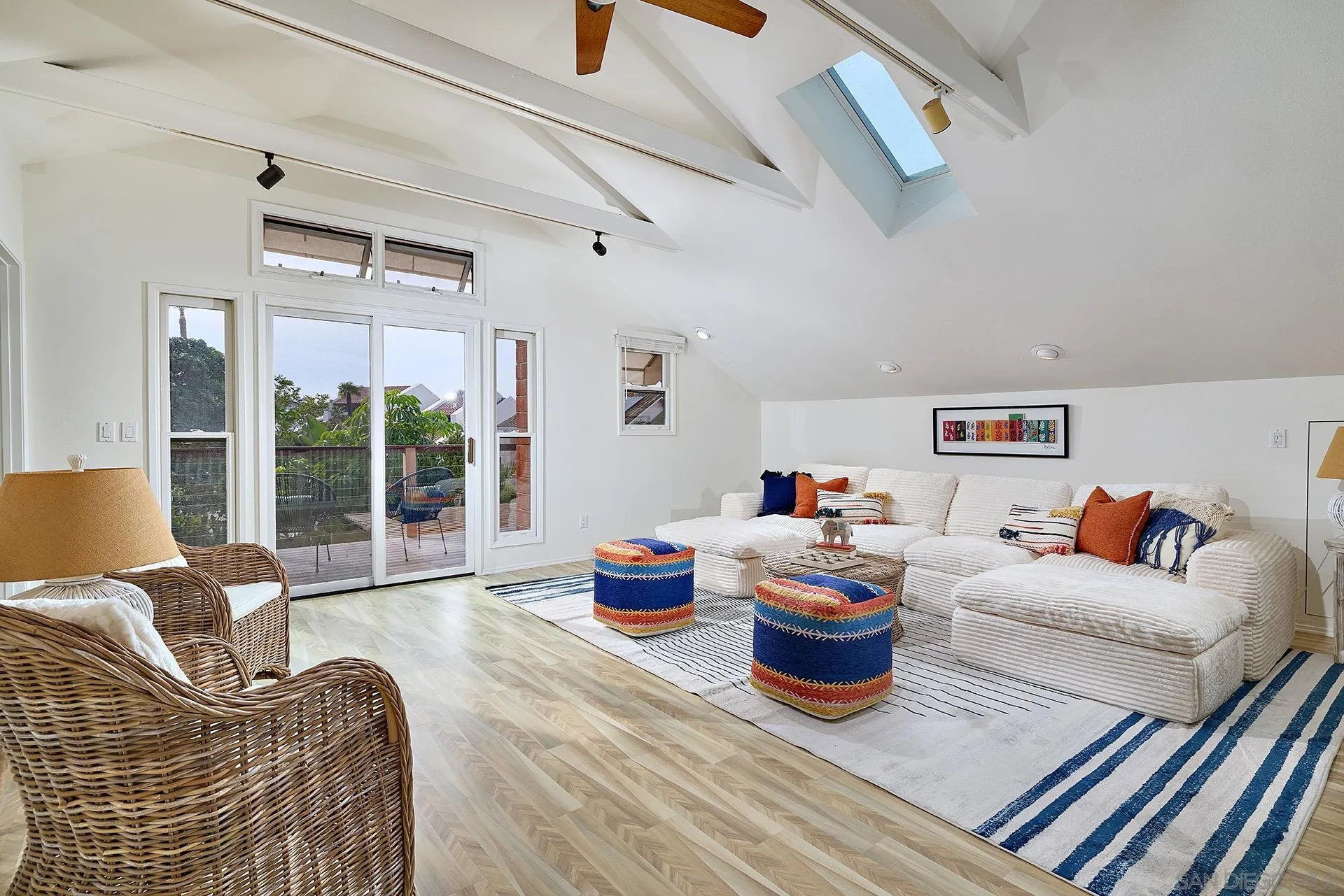 7627 Reposado Drive Carlsbad, CA 92009 - Photo 18 of 54 a living room with furniture and a floor to ceiling window