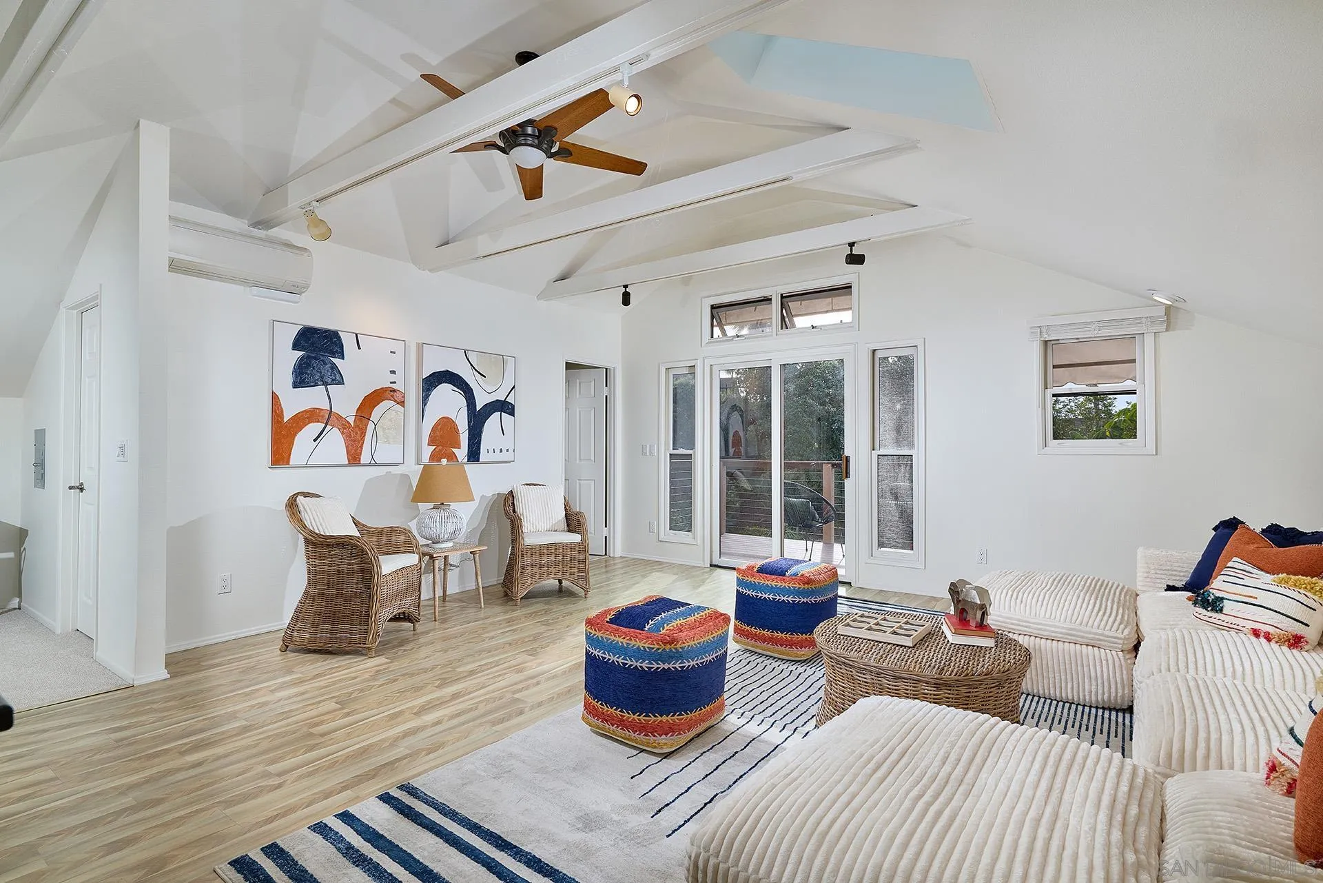 7627 Reposado Drive Carlsbad, CA 92009 - Photo 19 of 54 a living room with furniture and a potted plant