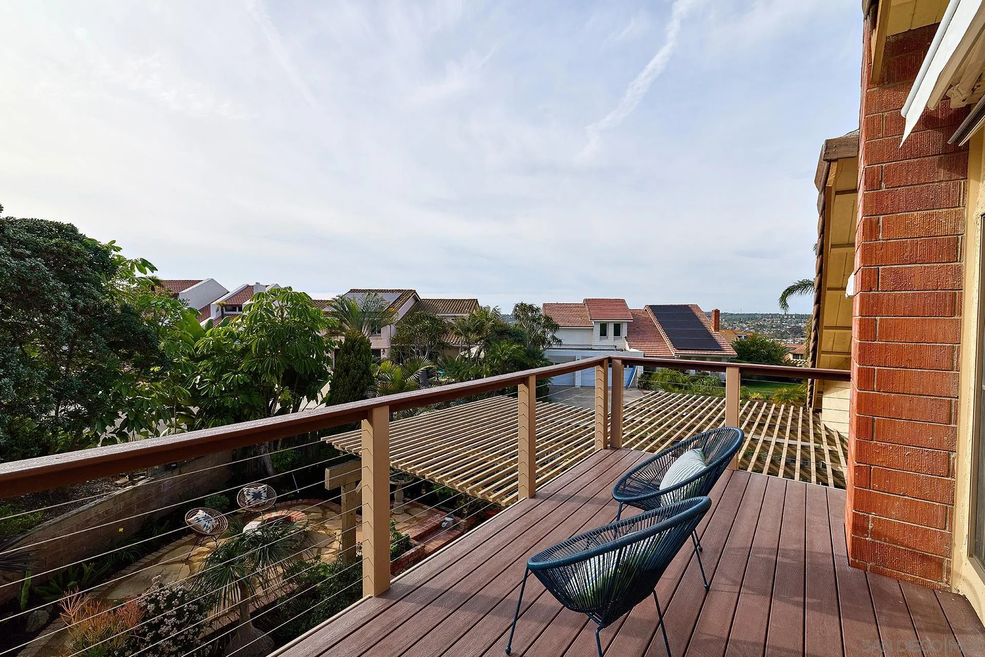 7627 Reposado Drive Carlsbad, CA 92009 - Photo 22 of 54 a view of balcony with wooden floor and fence