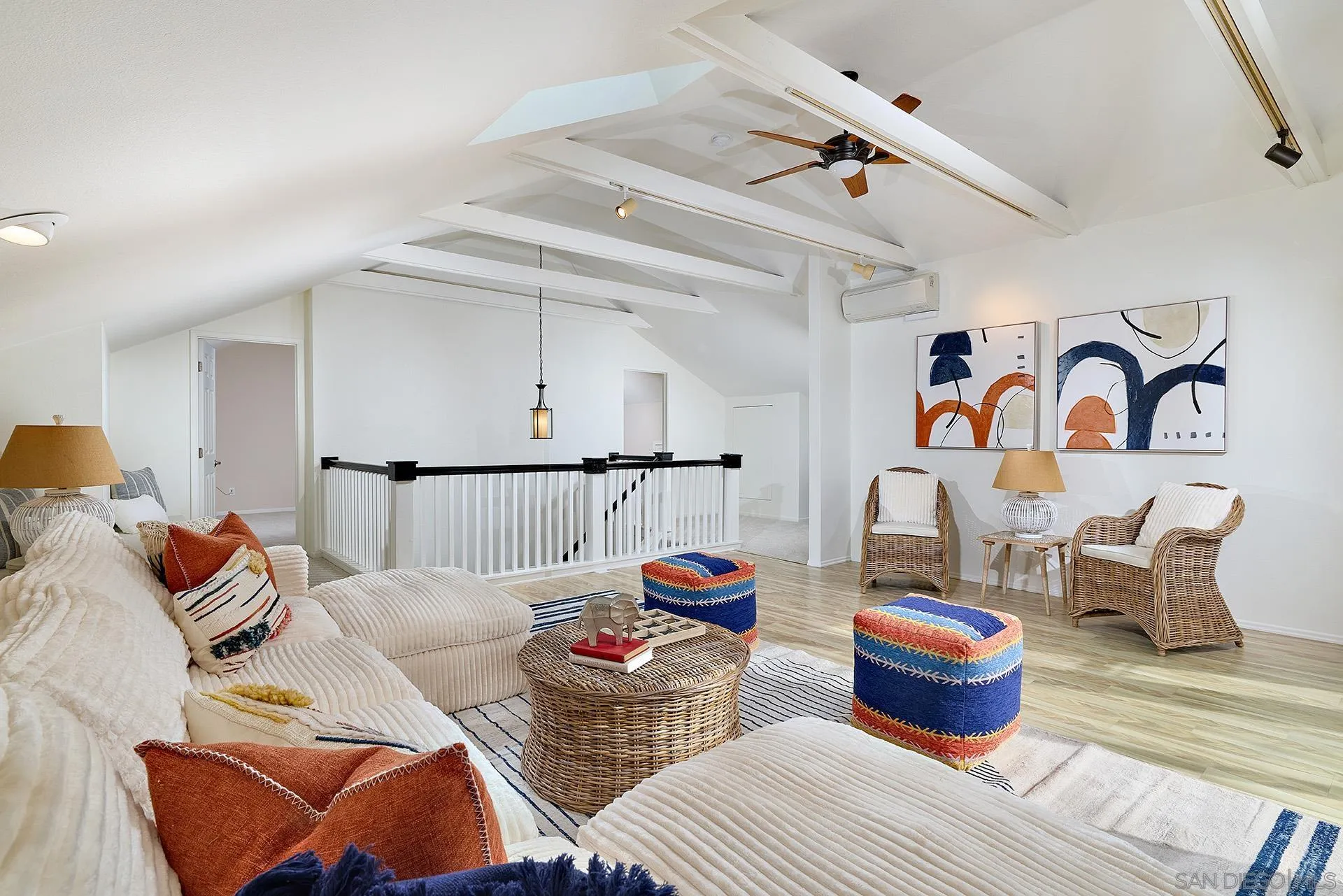 7627 Reposado Drive Carlsbad, CA 92009 - Photo 24 of 54 a living room with furniture and wooden floor