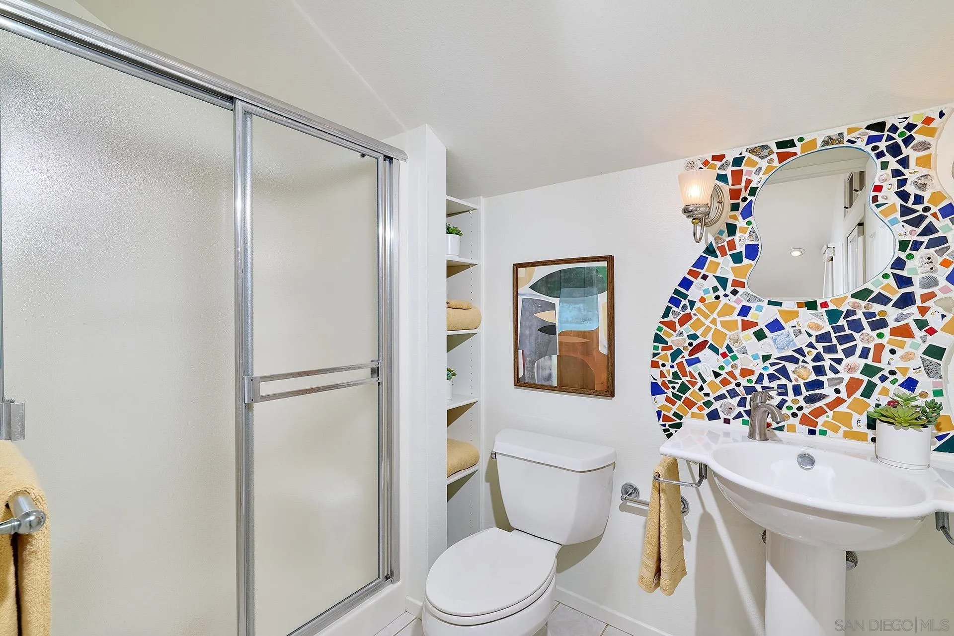 7627 Reposado Drive Carlsbad, CA 92009 - Photo 27 of 54 a bathroom with a sink toilet and shower