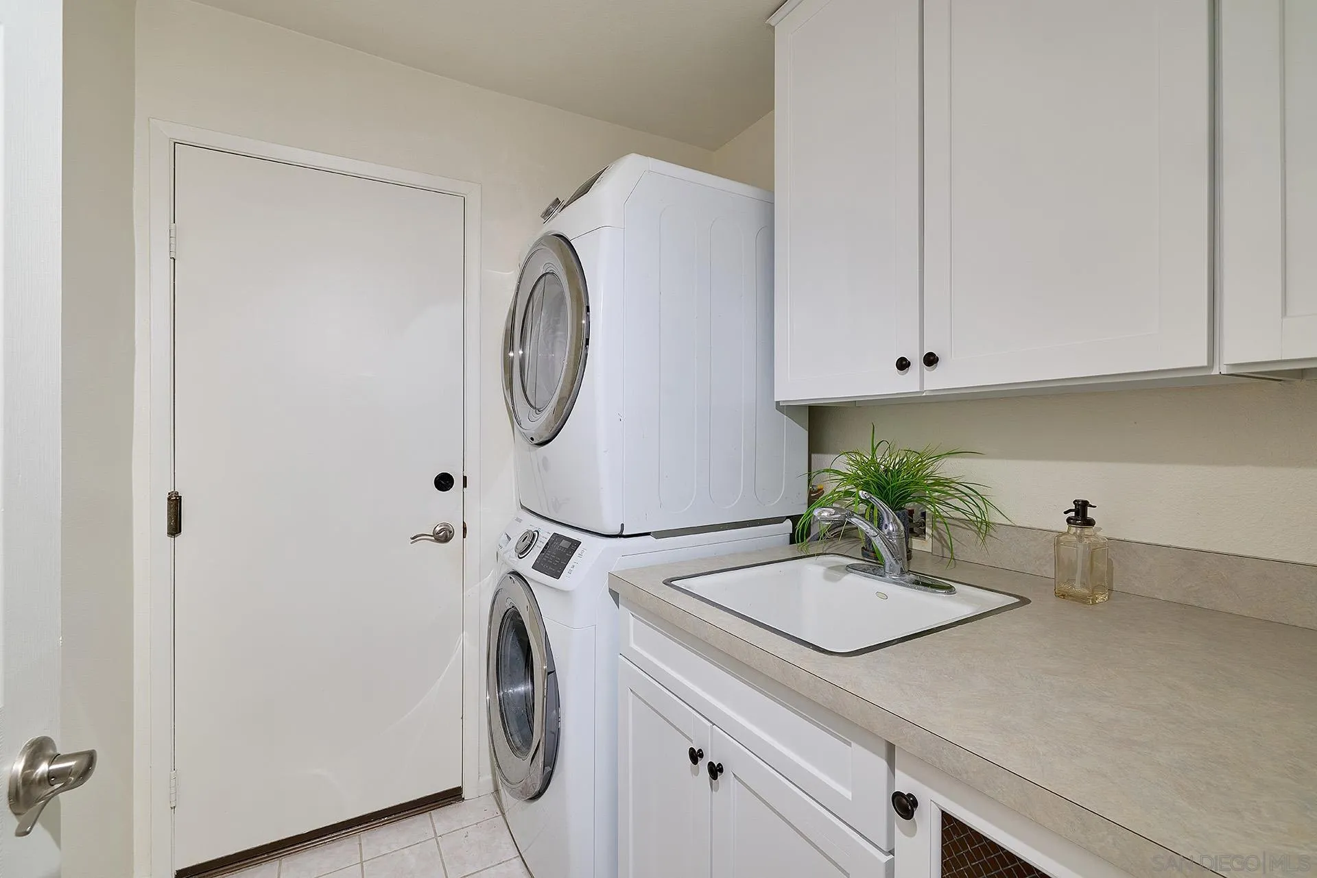 7627 Reposado Drive Carlsbad, CA 92009 - Photo 28 of 54 a room with a sink and cabinets