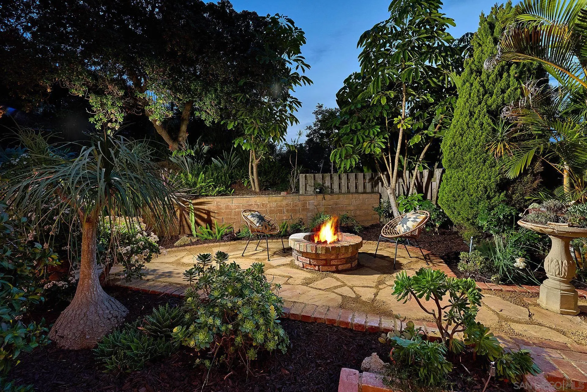 7627 Reposado Drive Carlsbad, CA 92009 - Photo 31 of 54 a view of a backyard with sitting area