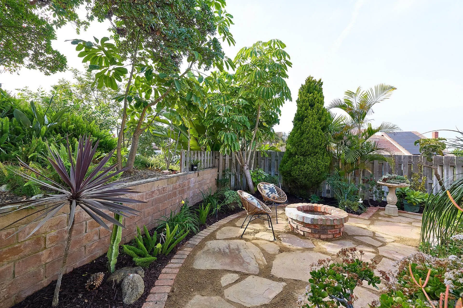 7627 Reposado Drive Carlsbad, CA 92009 - Photo 39 of 54 a view of a backyard with plants and outdoor seating
