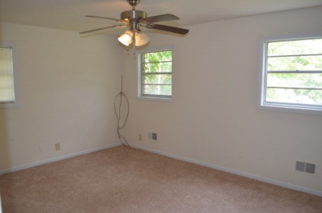 1847 Wood Valley Road Macon, GA 31211 - Photo 11 of 23 an empty room with windows and fan