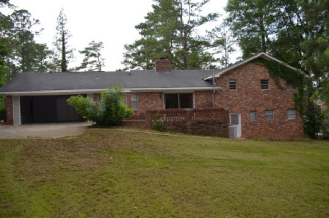 1847 Wood Valley Road Macon, GA 31211 - Photo 23 of 23 a front view of a house with a yard and garage