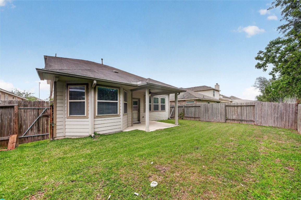 a view of a house with yard and sitting area