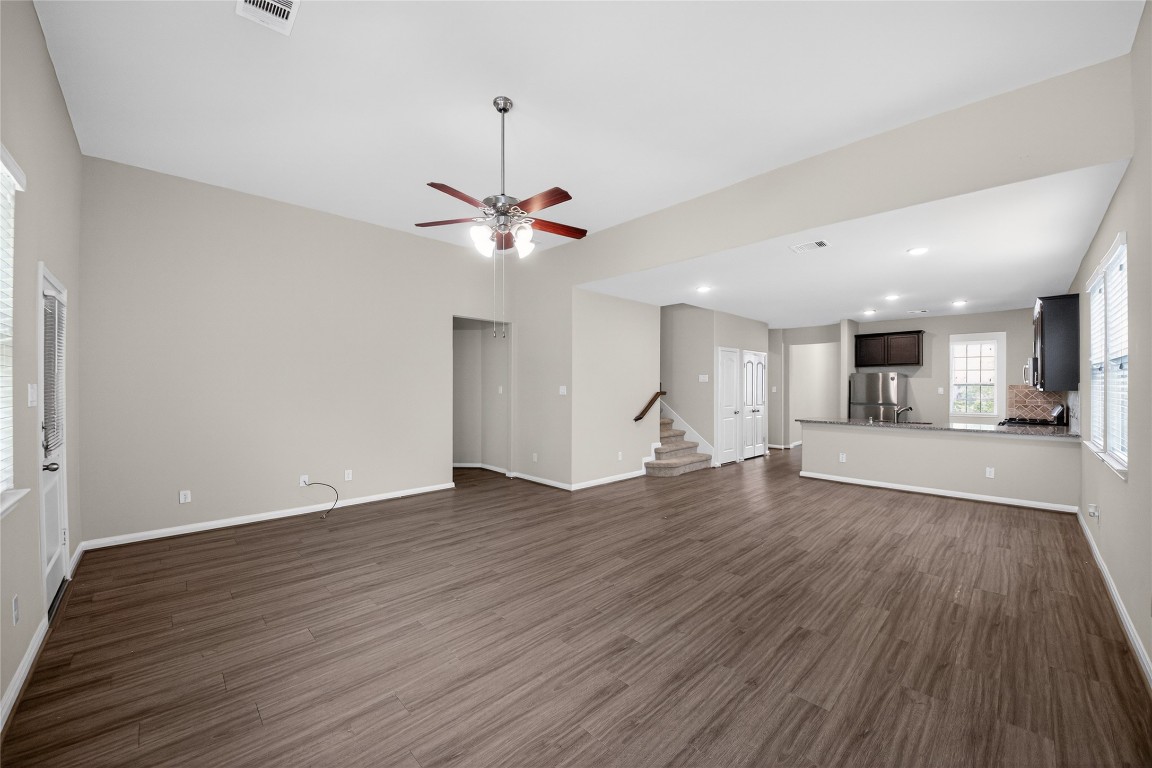 2518 Cold River Drive Humble, TX 77396 - Photo 12 of 35 a view of a room with wooden floors and ceiling fan