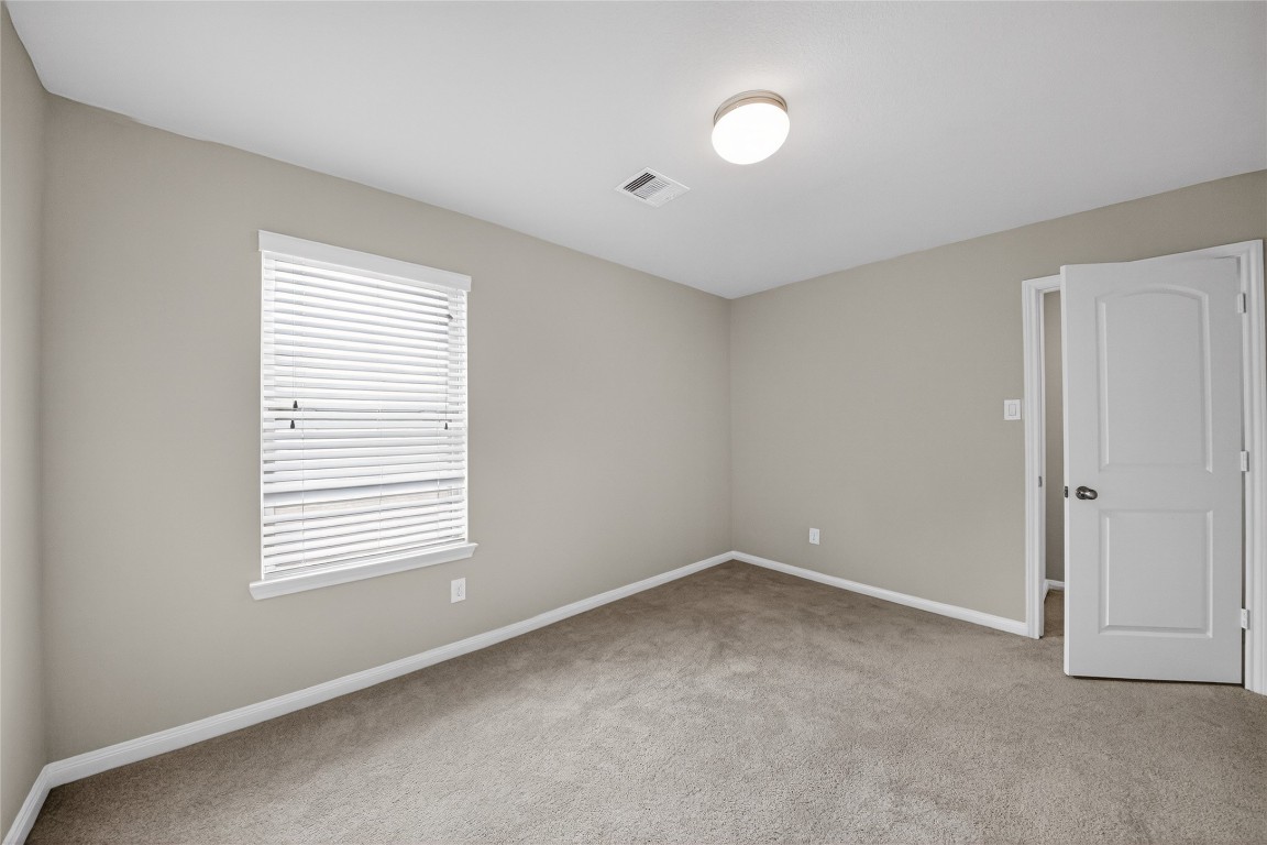 2518 Cold River Drive Humble, TX 77396 - Photo 16 of 35 a view of an empty room with a window