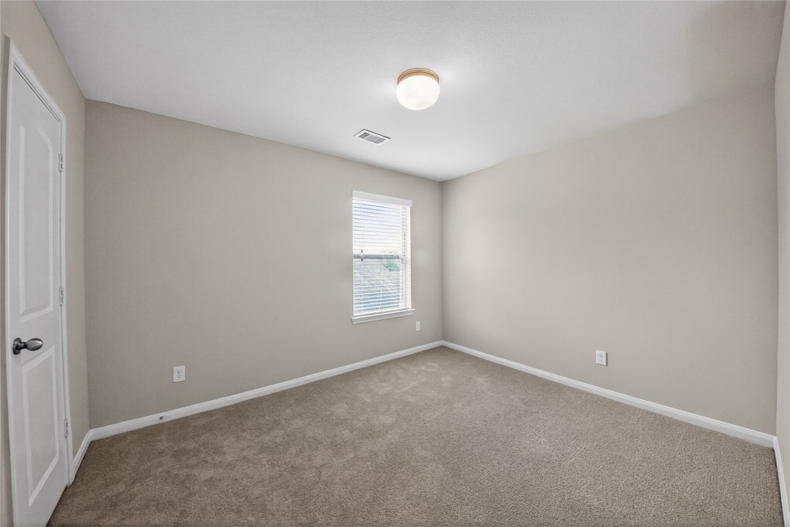 2518 Cold River Drive Humble, TX 77396 - Photo 17 of 35 a view of an empty room with a window