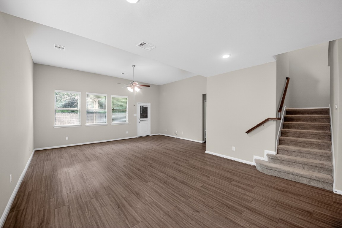 2518 Cold River Drive Humble, TX 77396 - Photo 22 of 35 a view of an empty room with wooden floor and a window