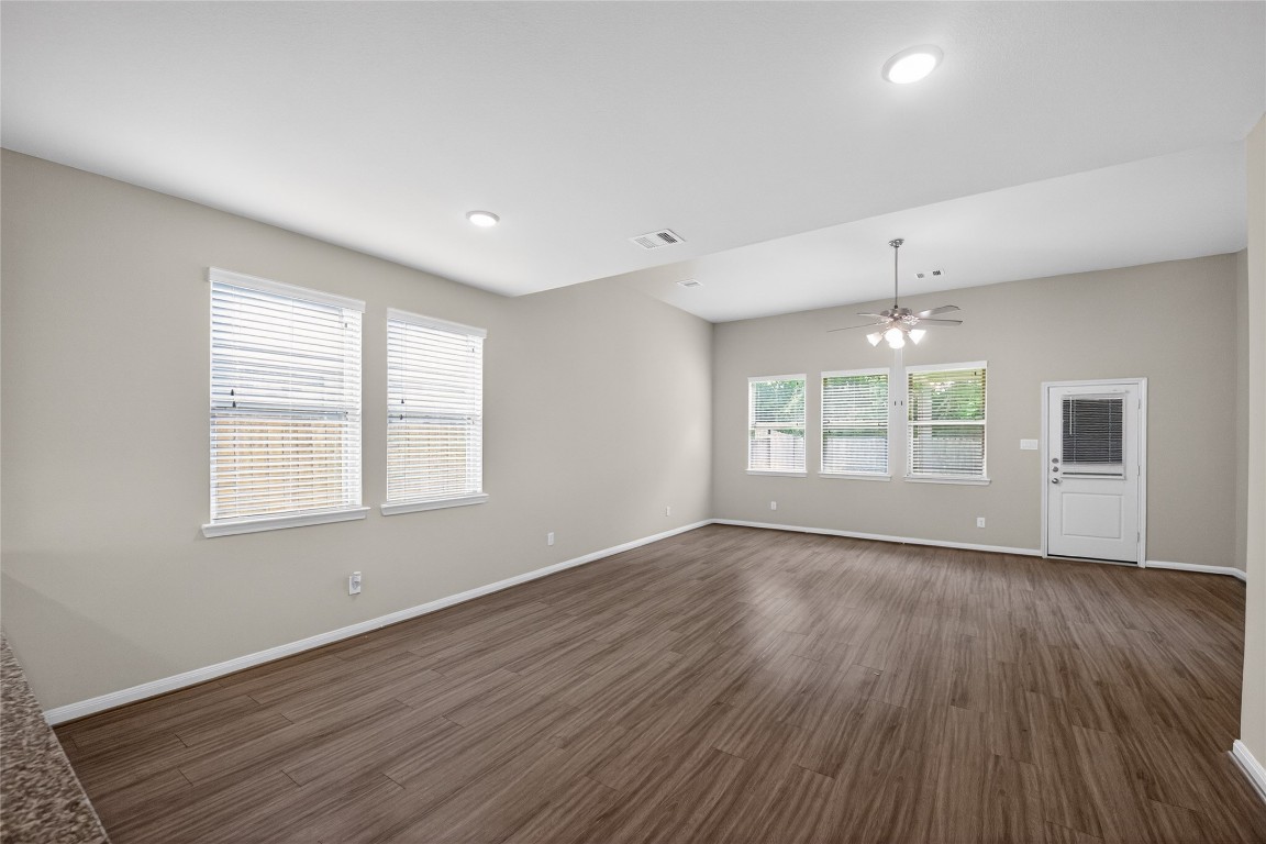2518 Cold River Drive Humble, TX 77396 - Photo 24 of 35 an empty room with wooden floor and windows