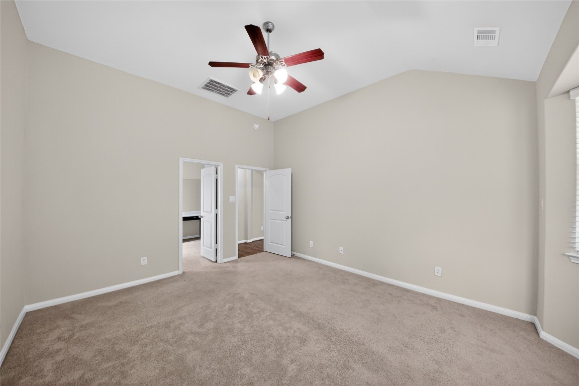 2518 Cold River Drive Humble, TX 77396 - Photo 28 of 35 an empty room with closet and ceiling fan