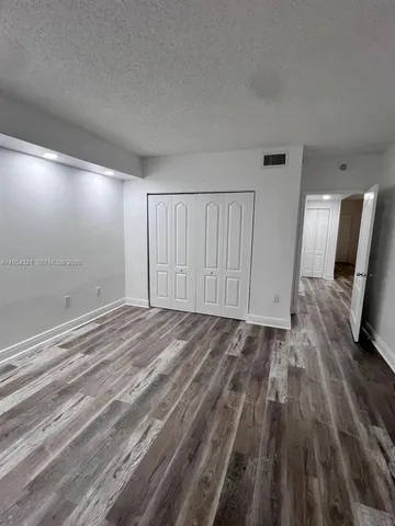 a view of a livingroom with wooden floor