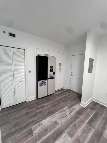 a kitchen with kitchen island a sink stainless steel appliances and cabinets