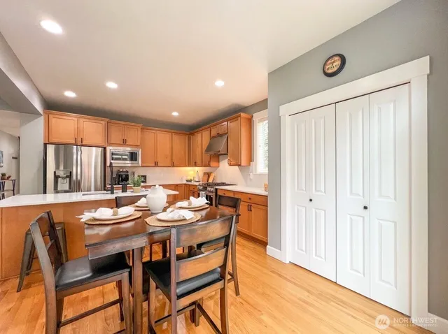 a dining room with furniture and a window