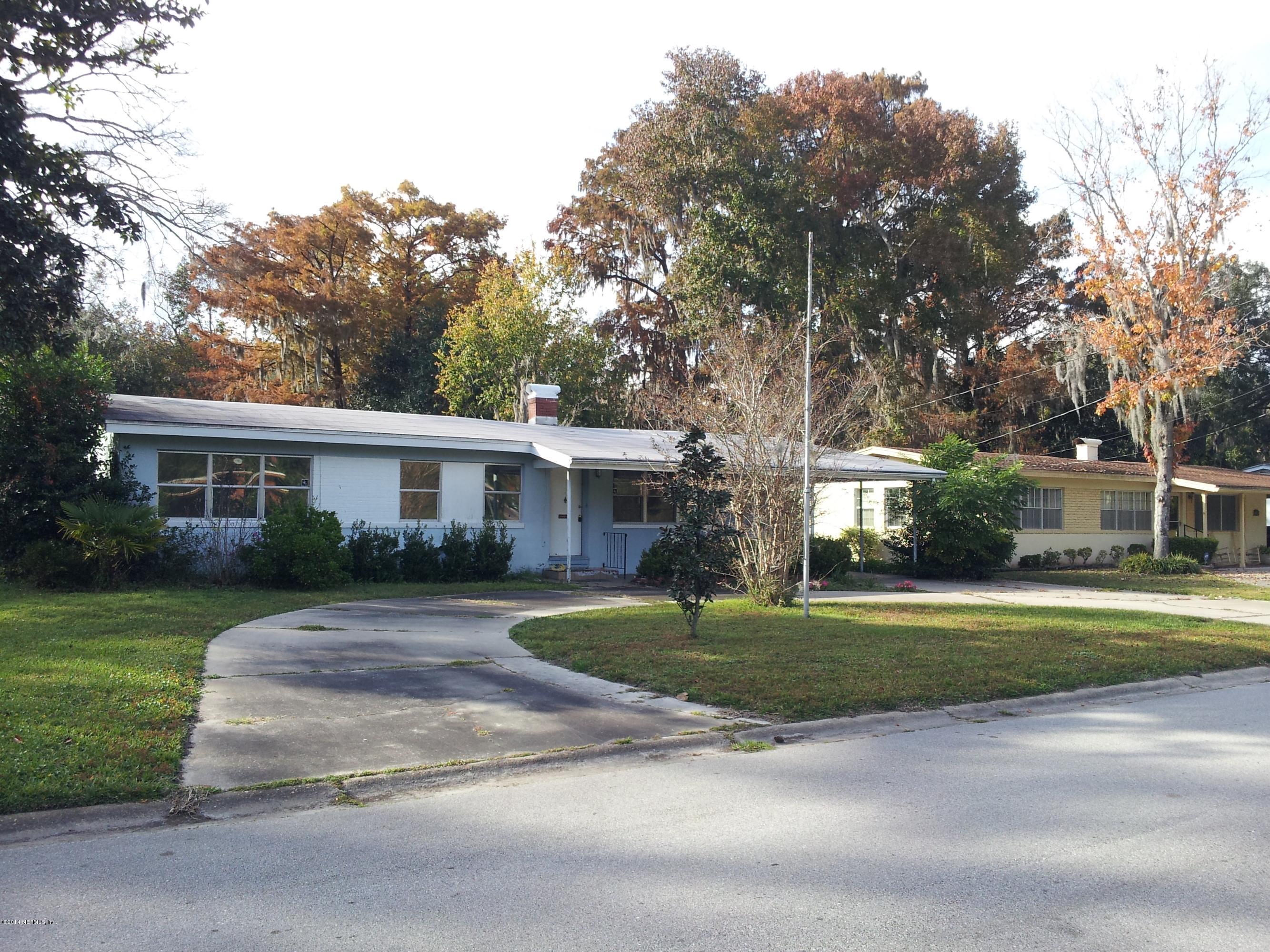 6542 Colgate Road Jacksonville, FL 32217 - Photo 1 of 9 a front view of a house with a garden