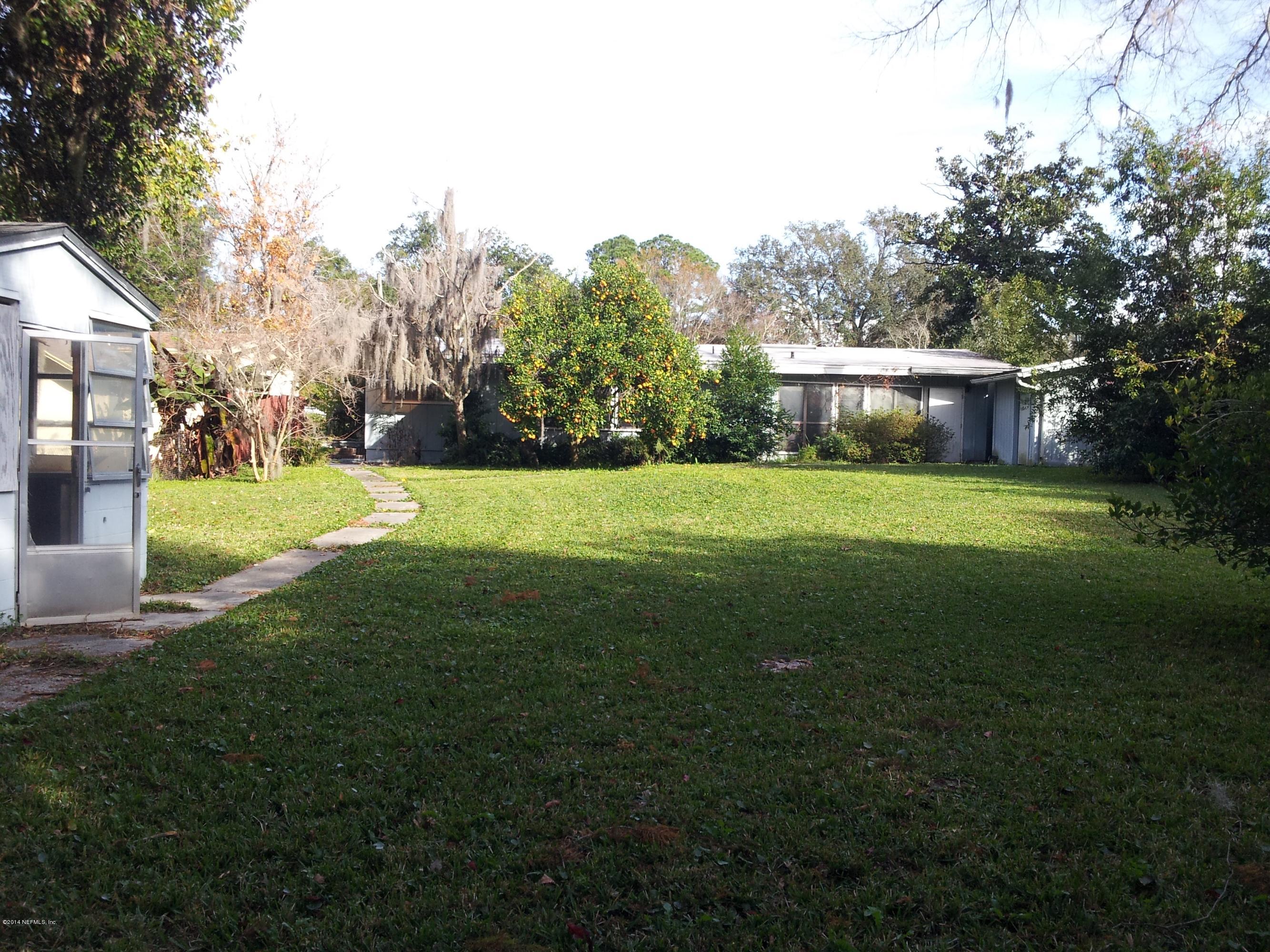 6542 Colgate Road Jacksonville, FL 32217 - Photo 2 of 9 a view of a big yard with large trees