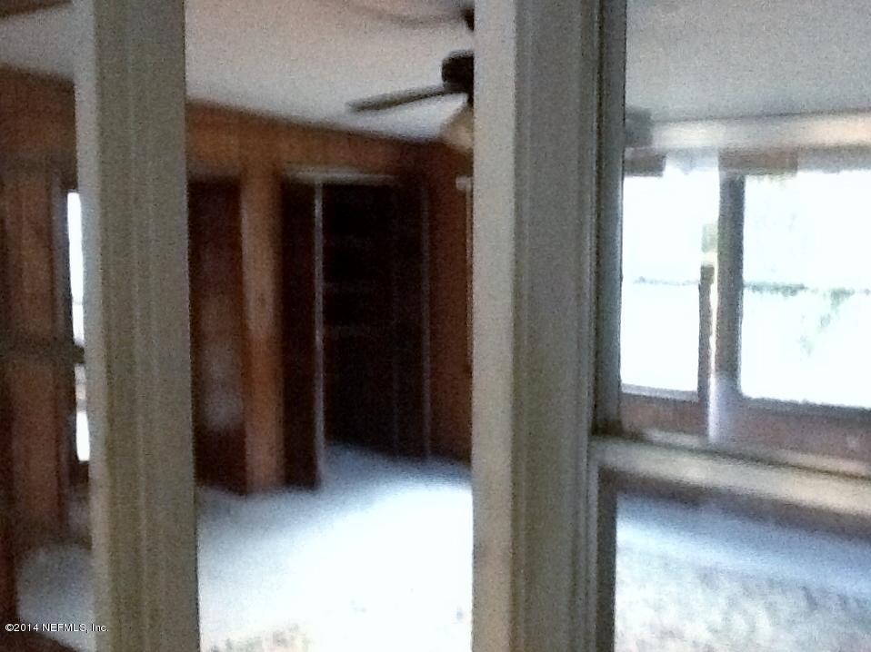 6542 Colgate Road Jacksonville, FL 32217 - Photo 7 of 9 a view of an empty room and window