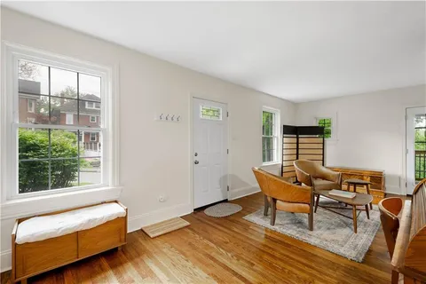 a living room with furniture and a window