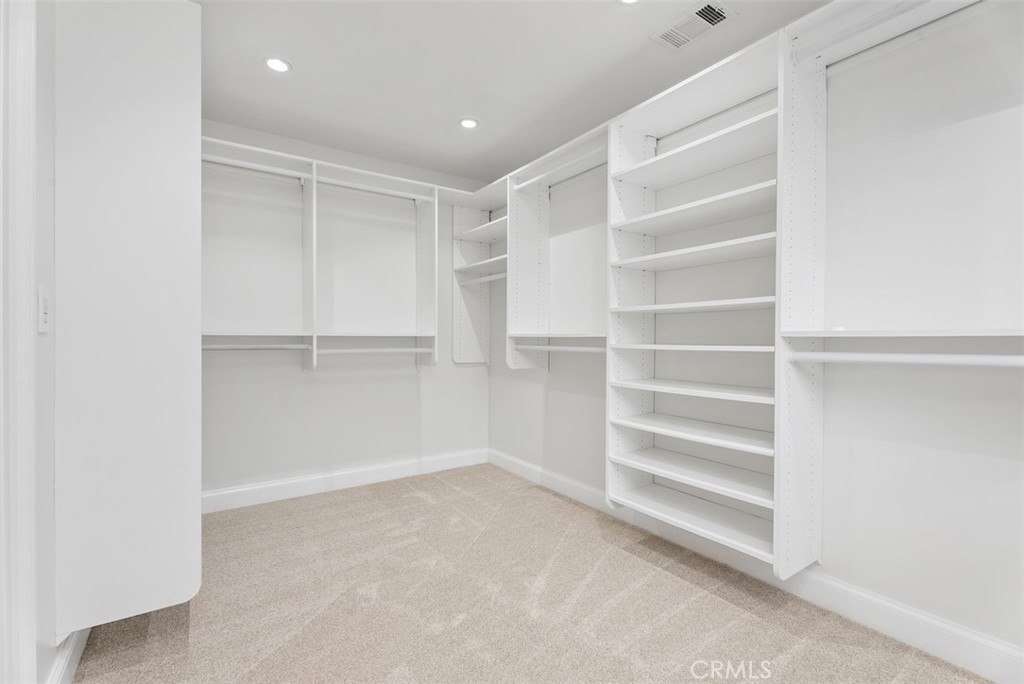 1015 Nottingham Road Newport Beach, CA 92660 - Photo 28 of 34 a view of walk in closet with empty racks