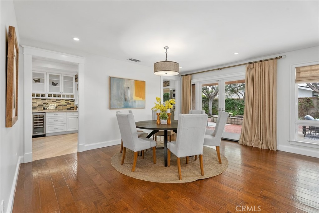 1015 Nottingham Road Newport Beach, CA 92660 - Photo 10 of 34 a view of a dining room with furniture window and wooden floor