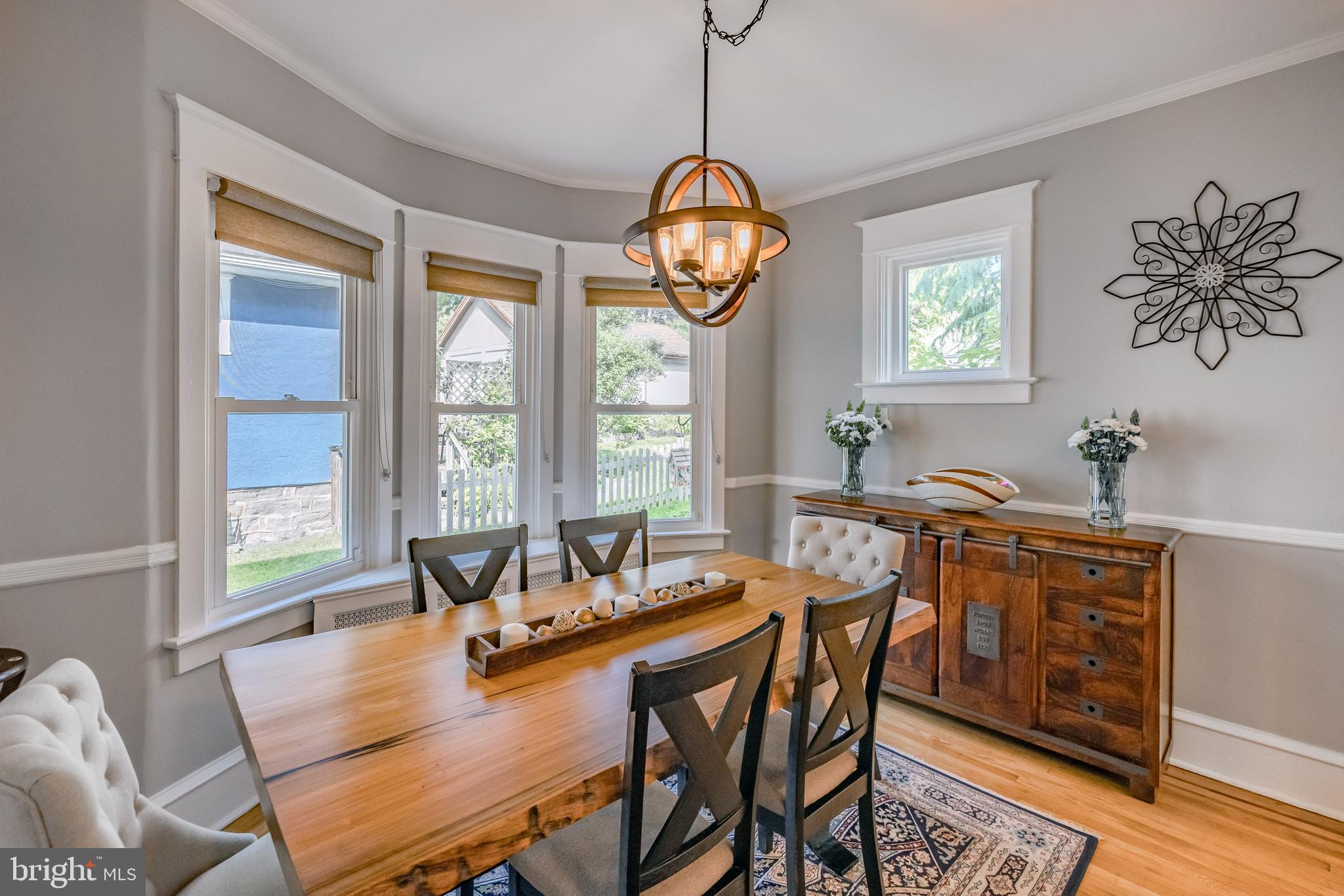 536 Kathmere Road Havertown, PA 19083 - Photo 16 of 45 a dining room with furniture a potted plant and a chandelier